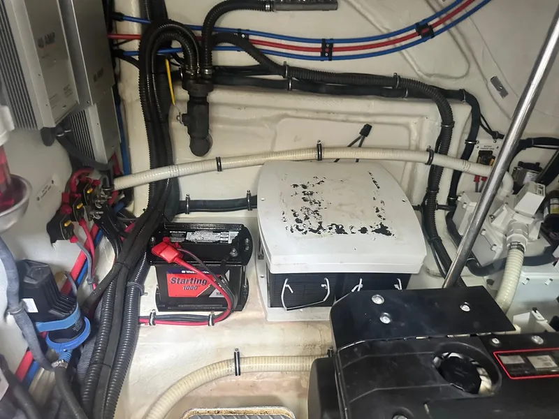 Slide: The Image of Engine room of a 2012 Formula 45 Yacht with visible wiring and battery. - 64