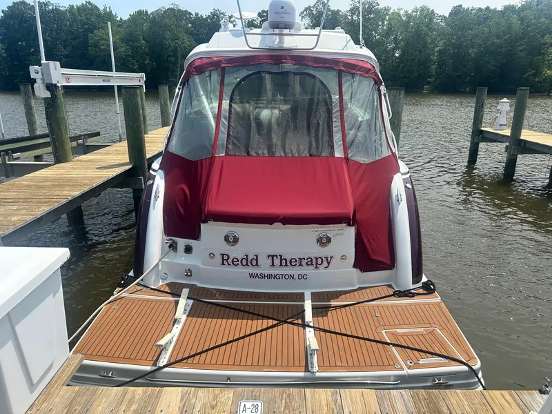 Slide: The Image of 2012 Formula 45 Yacht docked, featuring red canopy and "Redd Therapy" name, Washington, DC. - 7