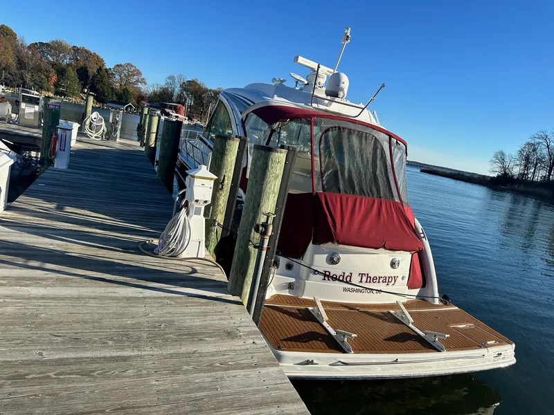 Slide: The Image of 2012 Formula 45 Yacht docked at marina with red canopy. - 9