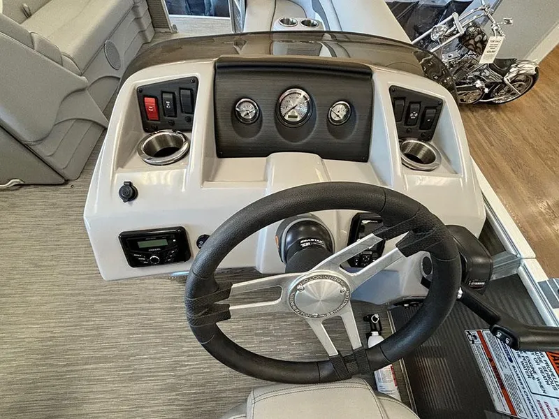 Slide: The Image of 2023 Bennington S 20 Cruise Narrow Beam boat dashboard with steering wheel and controls. - 10