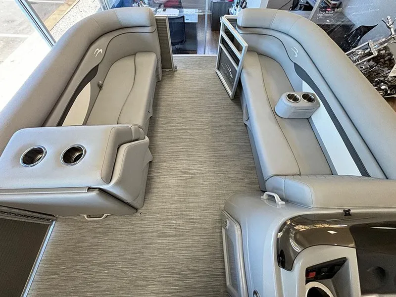 Slide: The Image of 2023 Bennington S 20 Cruise Narrow Beam interior with gray seating and cup holders. - 11