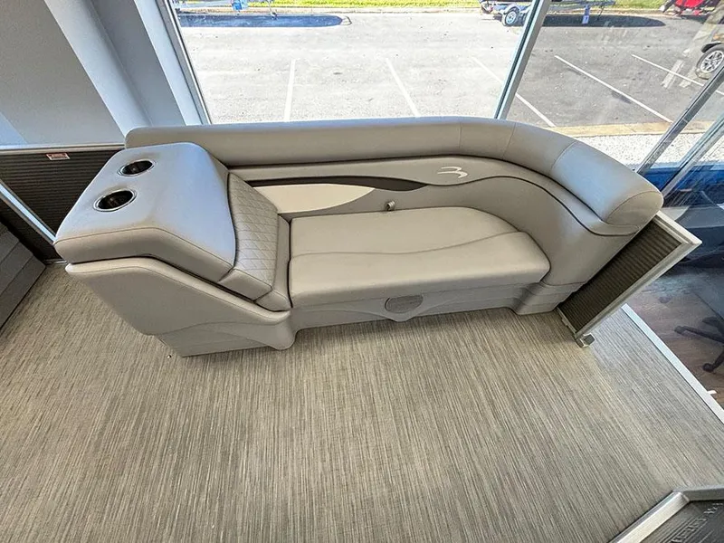 Slide: The Image of 2023 Bennington S 20 Cruise Narrow Beam boat interior with gray seating and cup holders. - 12