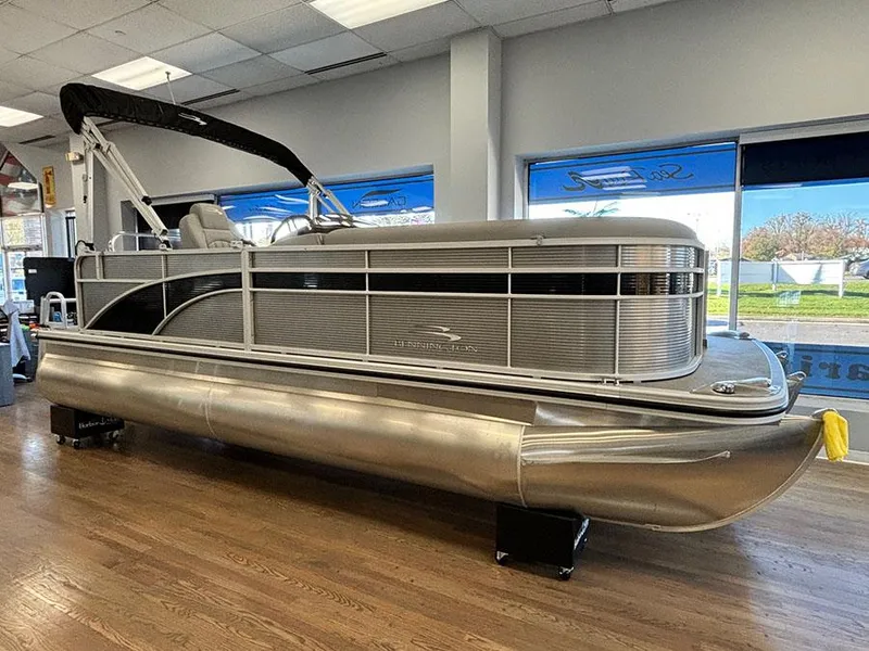 Slide: The Image of 2023 Bennington S 20 Cruise Narrow Beam pontoon boat displayed indoors. - 2