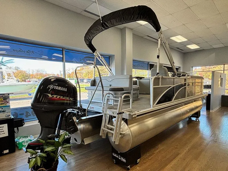 Slide: The Image of 2023 Bennington S 20 Cruise Narrow Beam pontoon boat displayed indoors. - 3