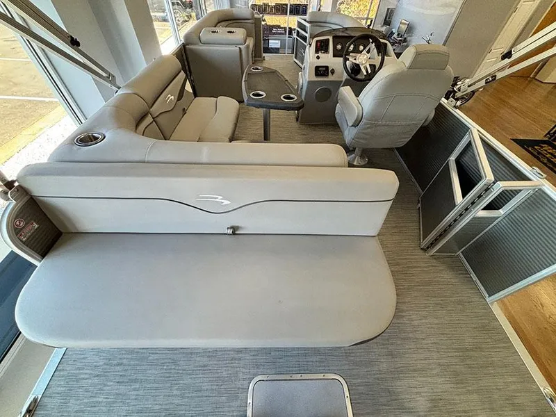 Slide: The Image of 2023 Bennington S 20 Cruise Narrow Beam interior with plush seating and modern helm. - 6