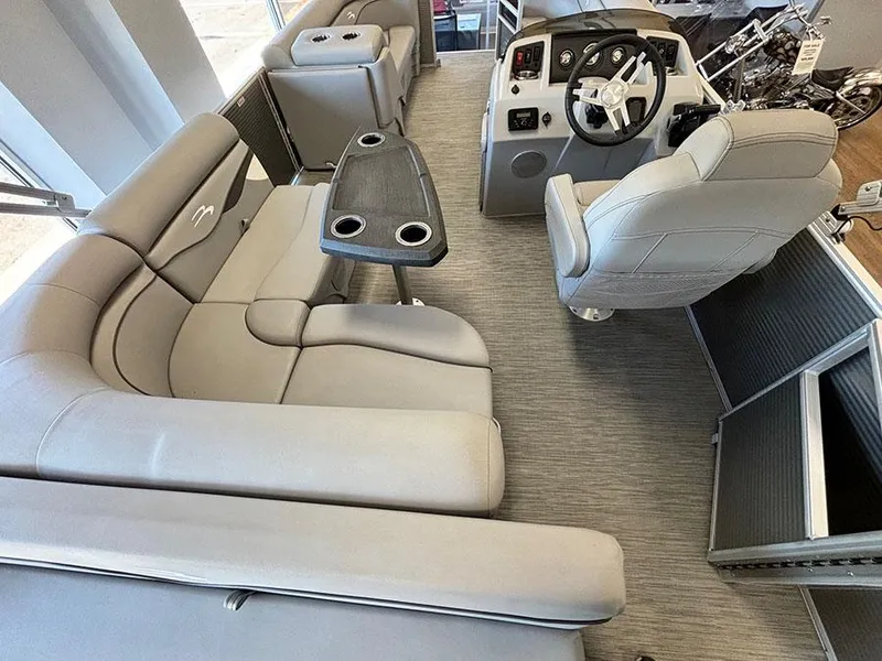 Slide: The Image of 2023 Bennington S 20 Cruise Narrow Beam interior with plush seating and modern helm. - 7