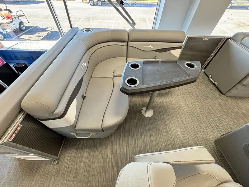 Slide: The Image of 2023 Bennington S 20 Cruise Narrow Beam interior with gray seating and table. - 8