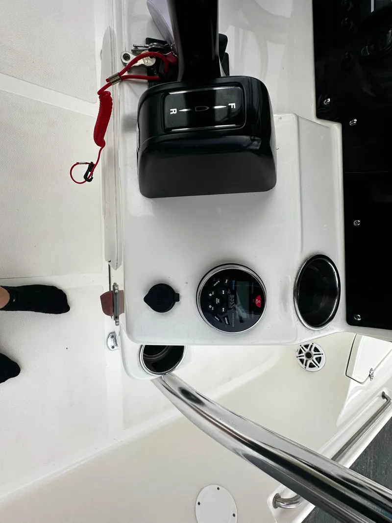 Slide: The Image of Control panel of 2022 Bulls Bay 2400 boat with throttle and gauges. - 10