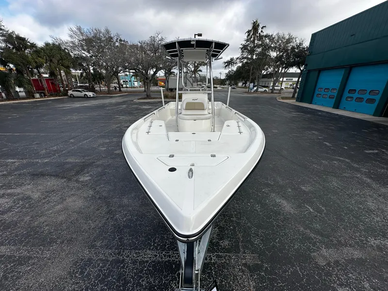 Slide: The Image of 2022 Bulls Bay 2400 boat parked outdoors, showcasing sleek design and spacious deck. - 4