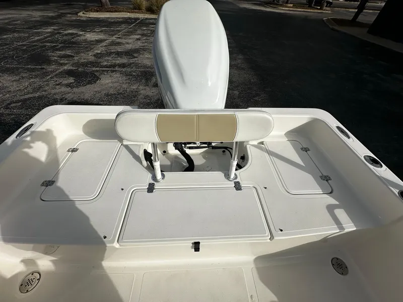 Slide: The Image of 2022 Bulls Bay 2400 boat deck with seating and storage compartments. - 6