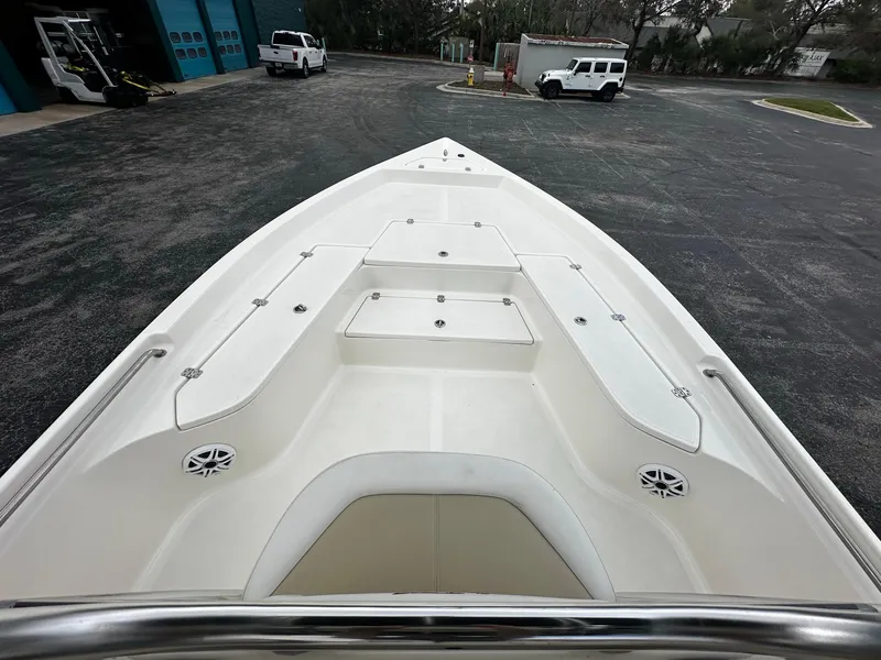 Slide: The Image of 2022 Bulls Bay 2400 boat deck with seating and storage compartments. - 9
