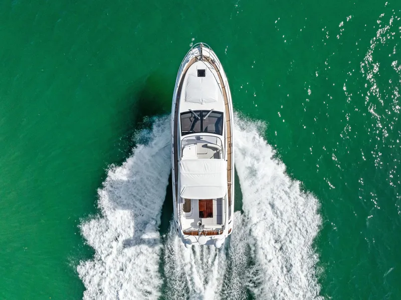Slide: The Image of Aerial view of 2014 Azimut 45 Fly yacht cruising on turquoise water. - 11