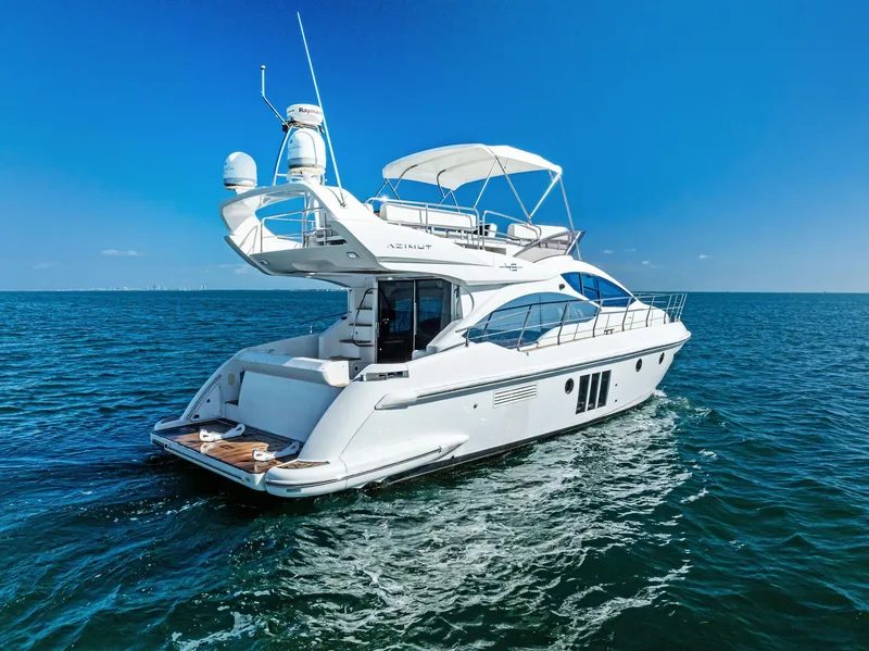 Slide: The Image of Azimut 45 Fly 2014 yacht cruising on open sea under clear blue sky. - 14