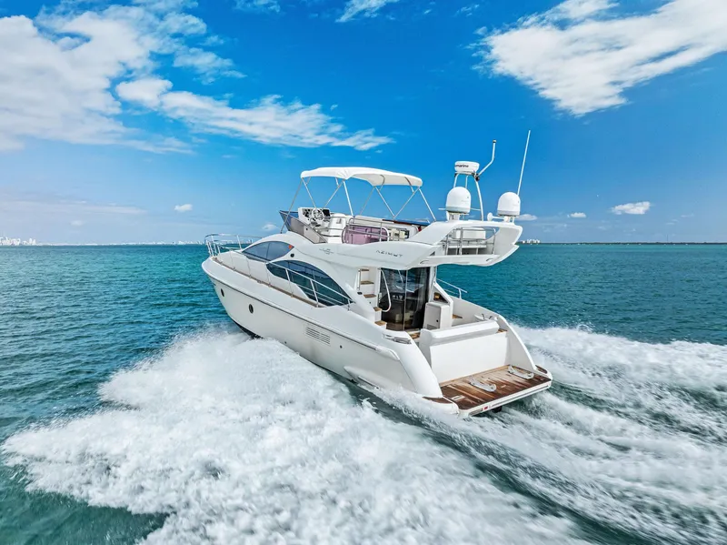 Slide: The Image of Azimut 45 Fly 2014 yacht cruising on open sea under clear blue sky. - 17