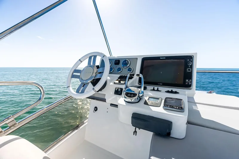 Slide: The Image of Azimut 45 Fly 2014 yacht helm with ocean view and modern navigation controls. - 24