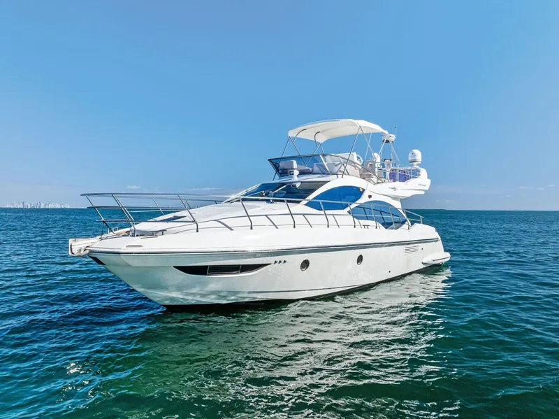Slide: The Image of Azimut 45 Fly 2014 yacht cruising on open sea under clear blue sky. - 3