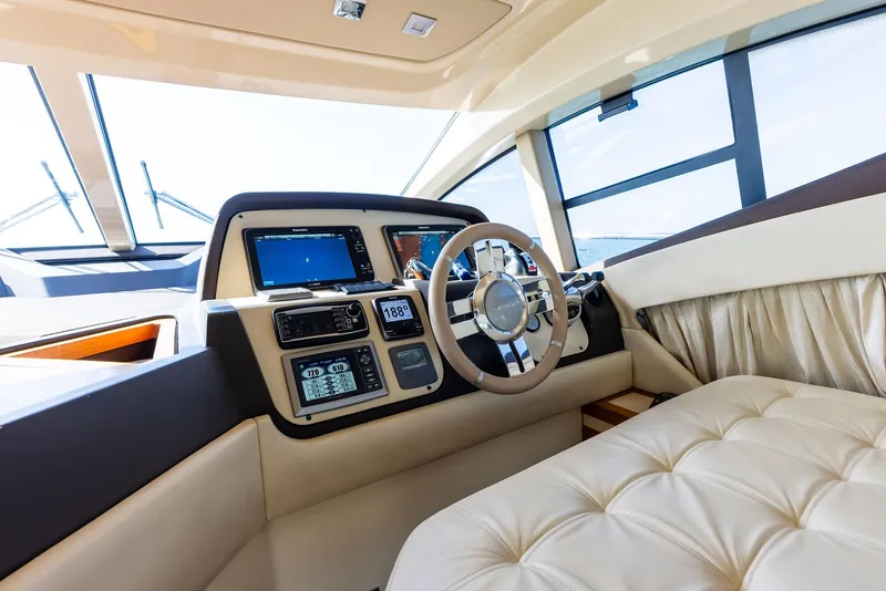 Slide: The Image of Luxurious interior of 2014 Azimut 45 Fly yacht with modern dashboard and steering wheel. - 40