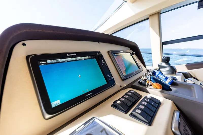 Slide: The Image of Control panel of 2014 Azimut 45 Fly yacht with navigation screens and ocean view. - 42