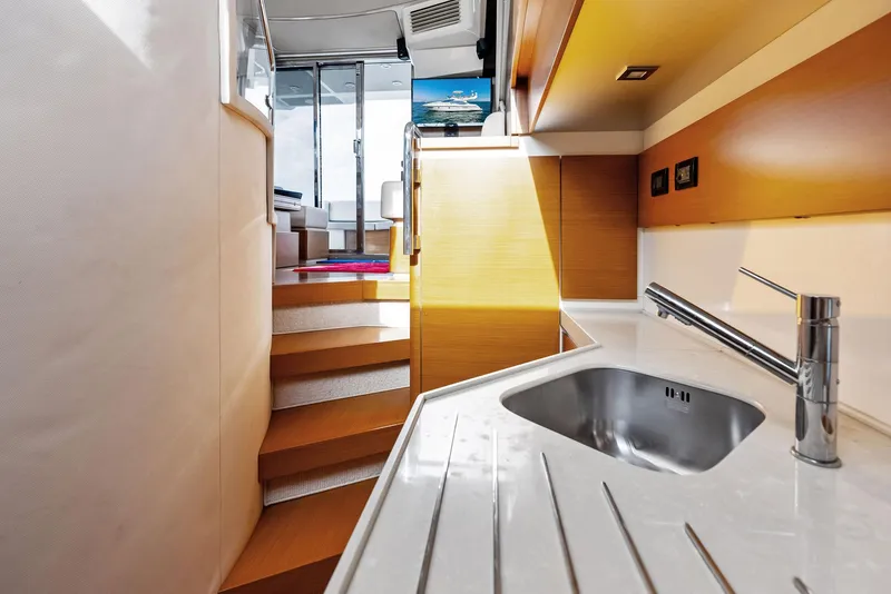 Slide: The Image of Azimut 45 Fly 2014 yacht interior with modern kitchen and staircase. - 44