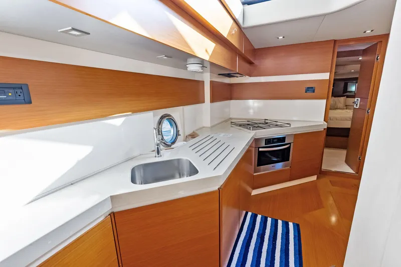 Slide: The Image of Luxurious kitchen interior of 2014 Azimut 45 Fly yacht with modern amenities. - 45