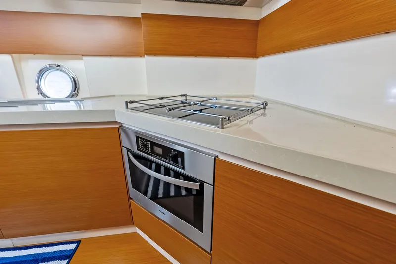 Slide: The Image of Modern kitchen interior of 2014 Azimut 45 Fly yacht with sleek wood cabinetry. - 48