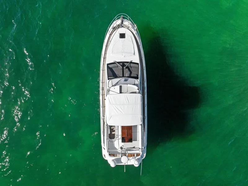 Slide: The Image of Aerial view of 2014 Azimut 45 Fly yacht on vibrant green water. - 6
