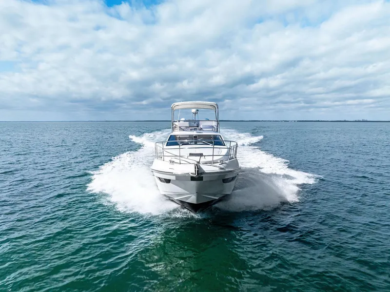 Slide: The Image of Azimut 45 Fly 2014 yacht cruising on open water under a cloudy sky. - 7