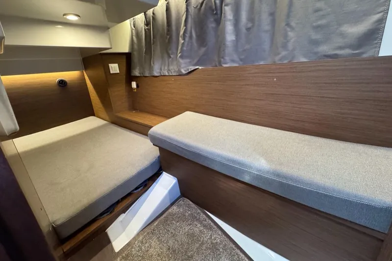 Slide: The Image of Interior cabin of 2020 Jeanneau NC Sport 895 with cozy seating and modern design. - 18