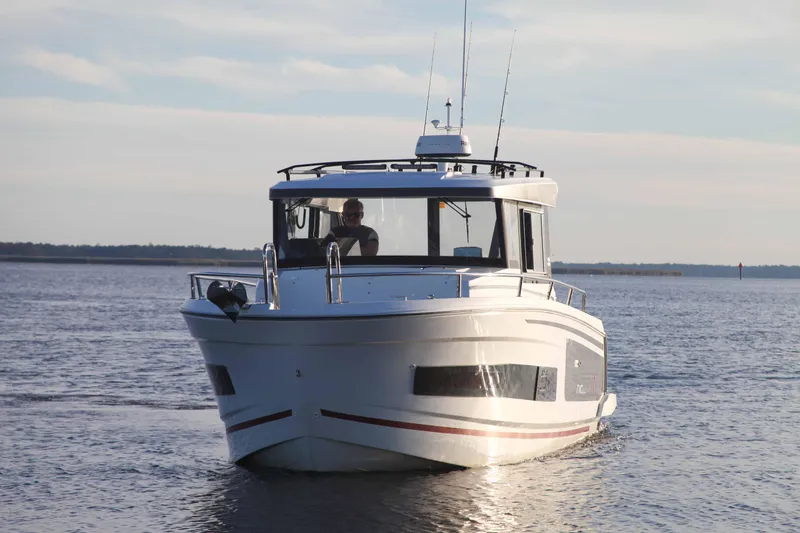 Slide: The Image of 2020 Jeanneau NC Sport 895 boat cruising on calm waters. - 2