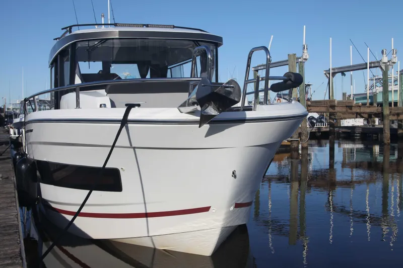 Slide: The Image of 2020 Jeanneau NC Sport 895 boat docked at marina. - 4