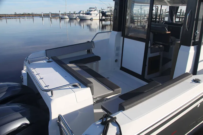 Slide: The Image of 2020 Jeanneau NC Sport 895 boat with spacious deck and seating area. - 5