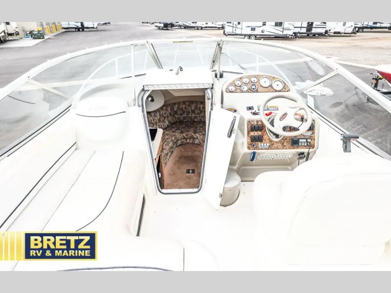 Slide: The Image of Interior view of 2000 Bayliner 2455 boat cockpit and cabin area. - 11