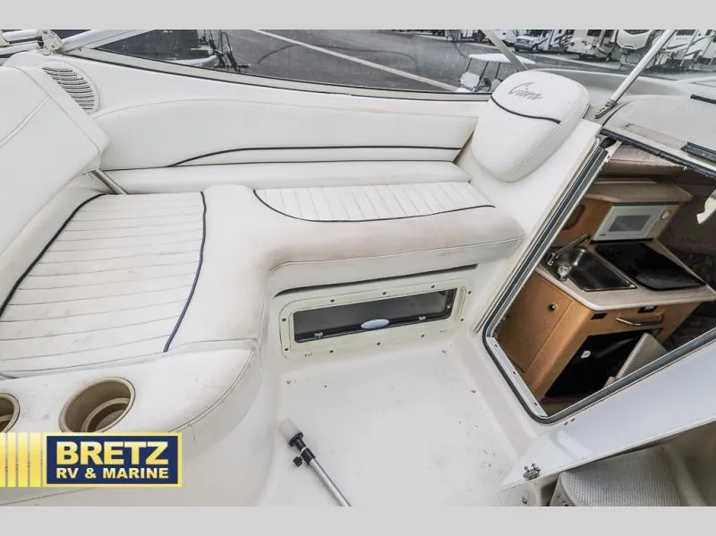 Slide: The Image of Interior of 2000 Bayliner 2455 boat with seating and kitchenette. - 14