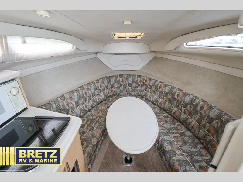 Slide: The Image of Interior of 2000 Bayliner 2455 boat with cozy seating and table. - 21