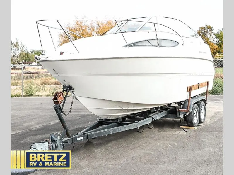 Slide: The Image of 2000 Bayliner 2455 boat on trailer at Bretz RV & Marine dealership. - 3