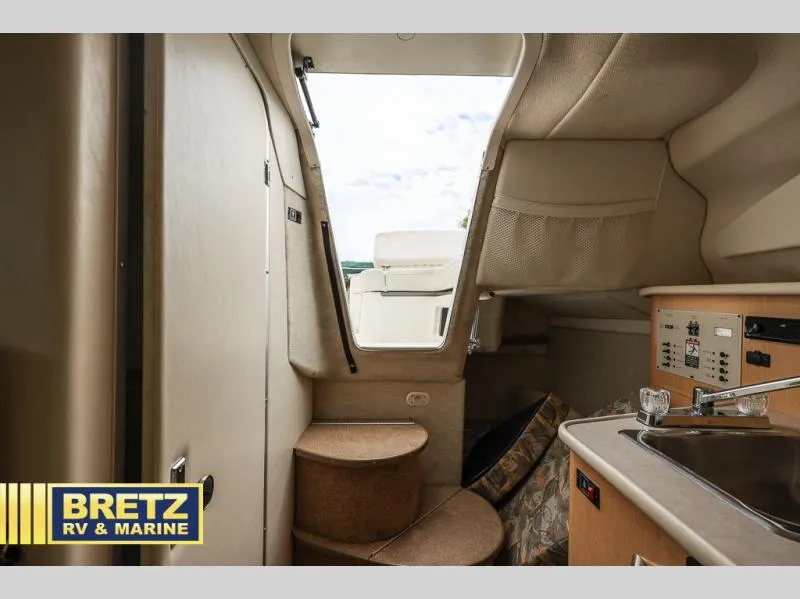 Slide: The Image of Interior of 2000 Bayliner 2455 boat with kitchenette and steps to deck. - 33