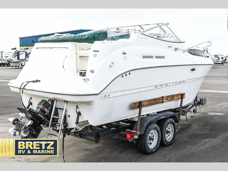 Slide: The Image of 2000 Bayliner 2455 boat on trailer at Bretz RV & Marine dealership. - 4