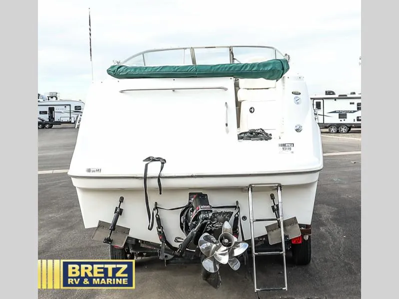 Slide: The Image of Rear view of 2000 Bayliner 2455 boat with outboard motor and ladder. - 5