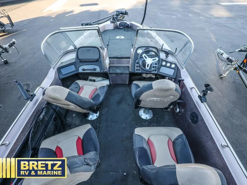 Slide: The Image of 2015 Skeeter WX1850 boat interior with four seats and control panel. - 10