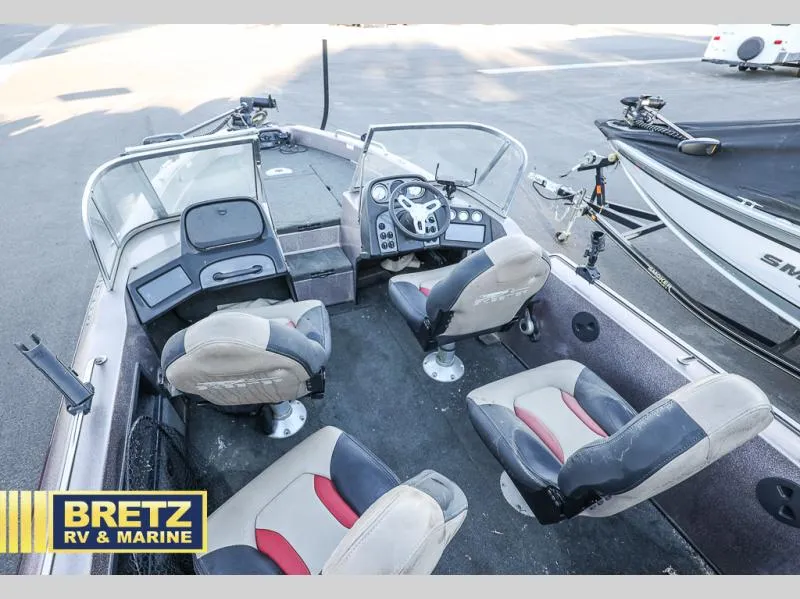 Slide: The Image of 2015 Skeeter WX1850 boat interior with seating and control panel at Bretz RV & Marine. - 11