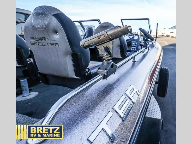 Slide: The Image of 2015 Skeeter WX1850 boat interior with rod holder, Bretz RV & Marine branding. - 17