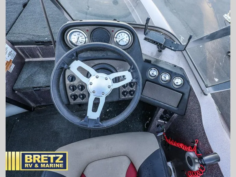 Slide: The Image of 2015 Skeeter WX1850 boat dashboard with steering wheel and gauges. - 23