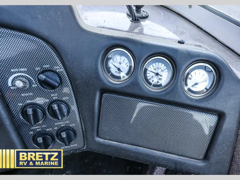 Slide: The Image of 2015 Skeeter WX1850 boat dashboard with gauges and controls, Bretz RV & Marine logo. - 24