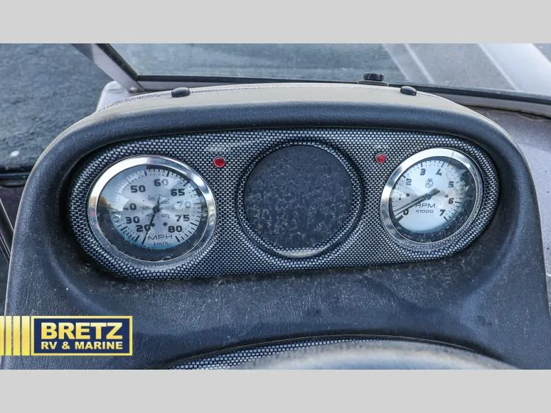 Slide: The Image of Dashboard of 2015 Skeeter WX1850 boat with speedometer and tachometer. - 25