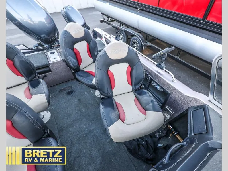Slide: The Image of 2015 Skeeter WX1850 boat interior with cushioned seats and steering console. - 8