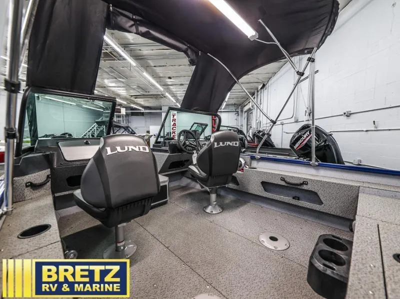 Slide: The Image of 2024 Adventure 1775 Sport boat interior with seating and canopy, displayed at Bretz RV & Marine. - 5
