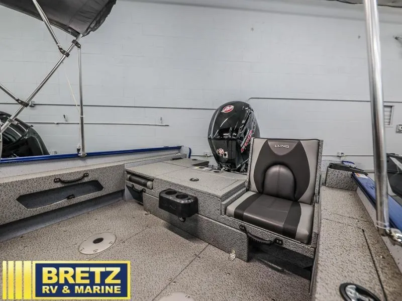 Slide: The Image of 2024 Adventure 1775 Sport boat interior with seating and motor, displayed at Bretz RV & Marine. - 6