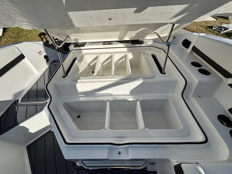 Slide: The Image of 2025 Cobalt R4 Outboard boat storage compartments, open and spacious, with sleek design. - 11