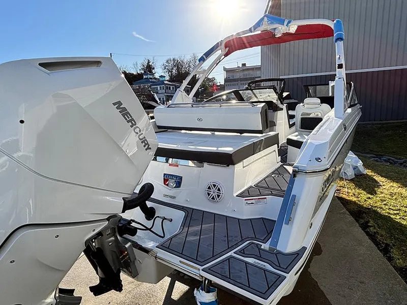 Slide: The Image of 2025 Cobalt R4 Outboard boat with Mercury engine, docked under sunlight. - 5