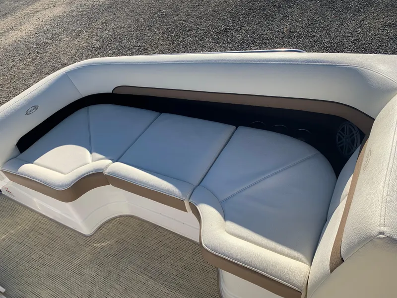 Slide: The Image of Luxurious seating on 2017 Marker One ML4 boat, featuring white and beige upholstery. - 11